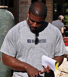 Priest Holmes speaks with soldiers CROPPED.jpg