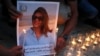 FILE - Family and friends of Al Jazeera reporter Shireen Abu Akleh attend a candle vigil outside the Church of the Nativity in the West Bank Biblical city of Bethlehem on May 16, 2022.