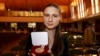 Fields Medals for Mathematics awardee Maryna Viazovska poses with her medal during the prize ceremony at the International Congress of Mathematicians 2022 (ICM 2022) in Helsinki, July 5, 2022. (Vesa Moilanen/Lehtikuva via Reuters) 