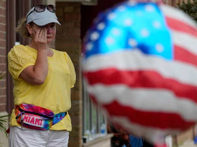 <p>Six people were killed and at least 36 more injured after a gunman perched on a rooftop opened fire on families waving flags and children riding bikes at the Independence Day event in the Chicago suburb </p>