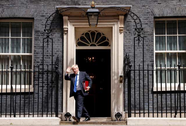 <p>Boris Johnson leaves Downing Street on Wednesday – only to return later </p>