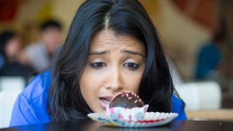 Woman looking at cake