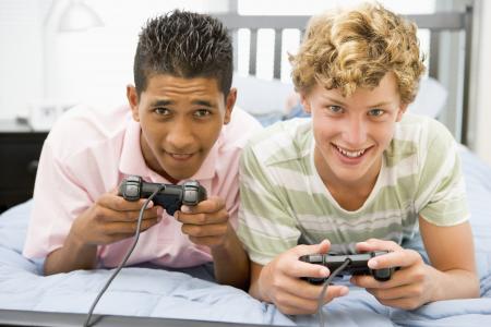 Teenage boys playing video games.