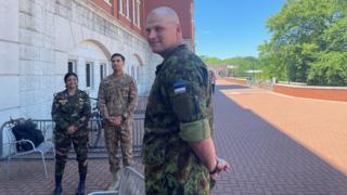 Man standing in uniform outside