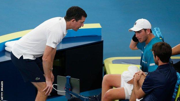 Tim Henman speaks to Cameron Norrie during the 2020 ATP Cup in Sydney