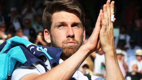 Cameron Norrie applauds the Centre Court crowd after losing the men's semi-final to Novak Djokovic