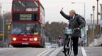 Mayor of London Boris Johnson cycles across Wandsworth Bridge