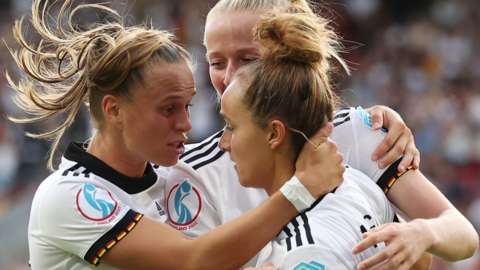 Germany's players celebrate scoring against Denmark at Euro 2022