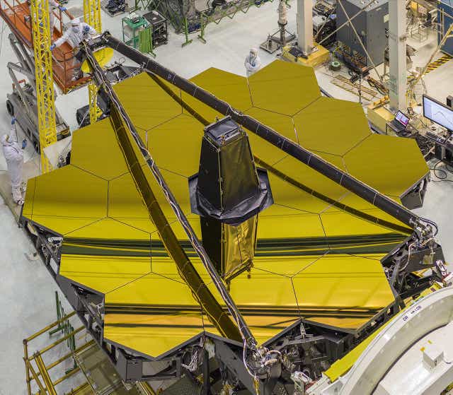 <p>The iconic gold mirror of the James Webb Space Telescope before it was launched into space</p>