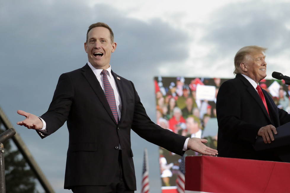 Republican candidate for U.S. Senate Rep. Ted Budd (N.C.), left, reacts as he takes the stage with former President Donald Trump.