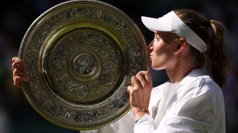 elena rybakina with trophy