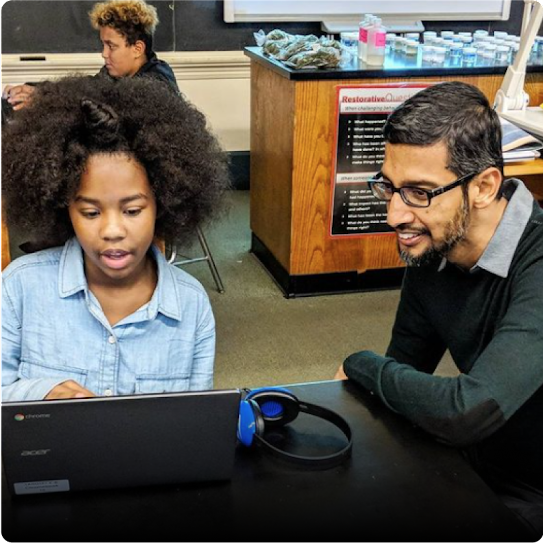 Sundar Pichai visits with students at Langley K-8 School in Pittsburgh, Pennsylvania.