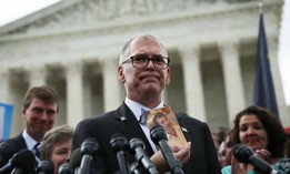  Jim Obergefell holds a photo of his late husband John Arthur as he speaks to members of the media after the U.S. Supreme Court handed down a ruling regarding same-sex marriage June 26, 2015 outside the Supreme Court in Washington, DC. 