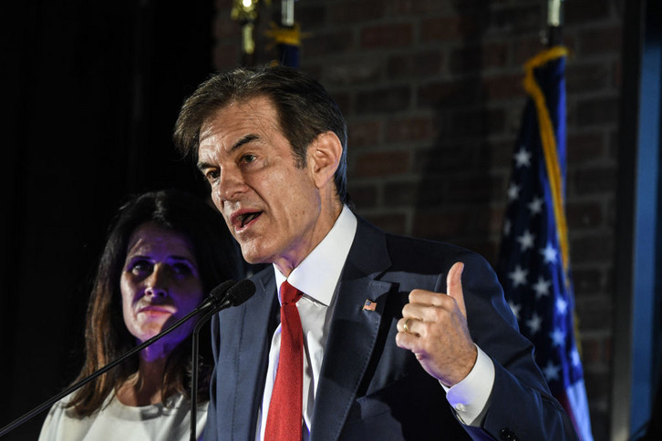 Republican Senate candidate Mehmet Oz greets supporters.