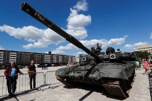 <p>People look at Russian military equipment destroyed by the armed forces of Ukraine displayed in Prague</p>
