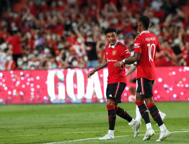 <p>Jadon Sancho is congratulated by Marcus Rashford</p>