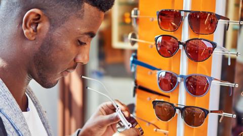 Man trying sunglasses