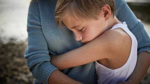 Child hugs his mother