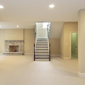 Basement with stone fireplace