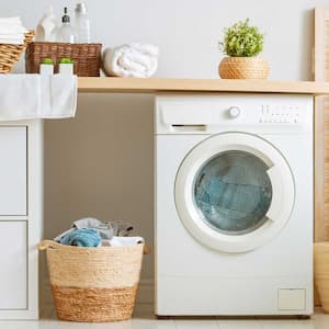 Small washing machine in a laundry room