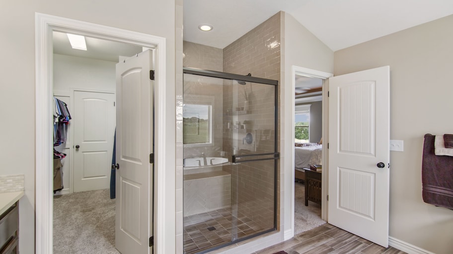 A walk-in closet with a hinged door