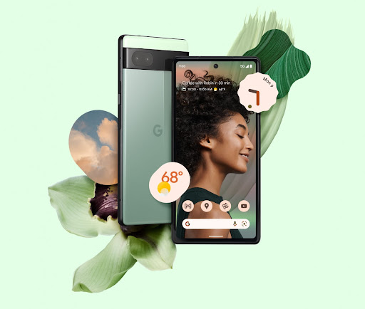 Angled front and back of Sage green Pixel 6a with flowers, clouds, and a smiling portrait as the background