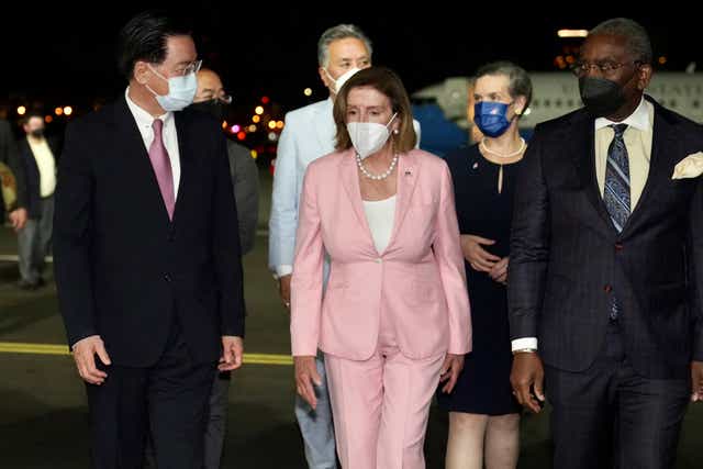 <p>In this photo released by the Taiwan Ministry of Foreign Affairs, US House Speaker Nancy Pelosi, centre, arrives in Taipei, Taiwan, on 2 August 2022</p>