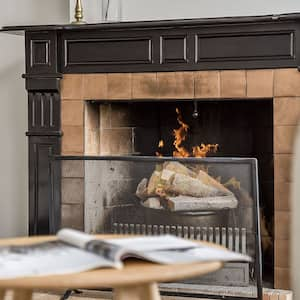 living room with lit fireplace