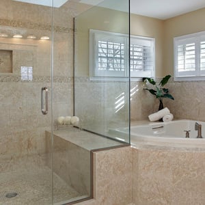 A luxurious bathroom with a glass shower room