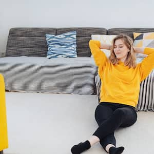 Woman enjoying clean carpet