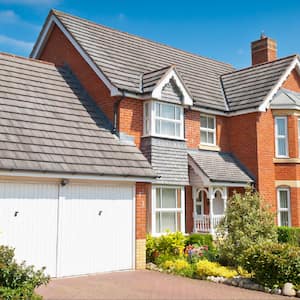 brick house exterior with garage as focal point