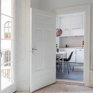 kitchen area with white wood door