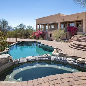 Swimming pool with hot tub and terraced patio