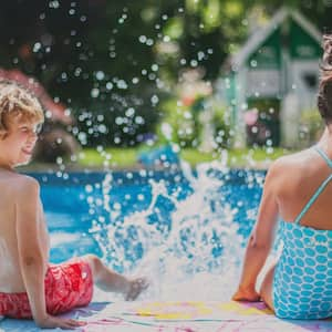 Two kids having fun in pool