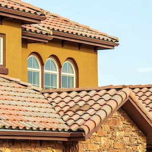 Ceramic shingles roof of a stone house