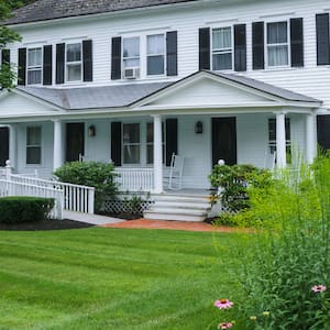 big white house with ramp entrance