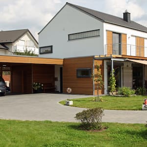 A carport situated next to a detached house