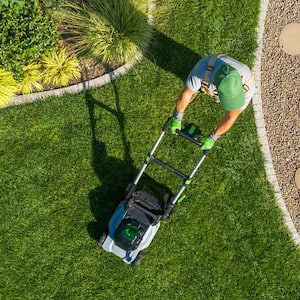 Aerial view of man mowing yard