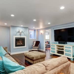 Pastel blue walls in a basement living room