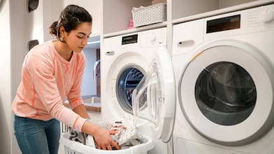 Person doing laundry at home