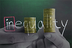 Image of 2 hands holding unequal stacks of coins.