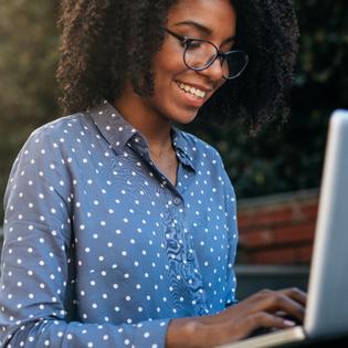 woman looking at her laptop computer