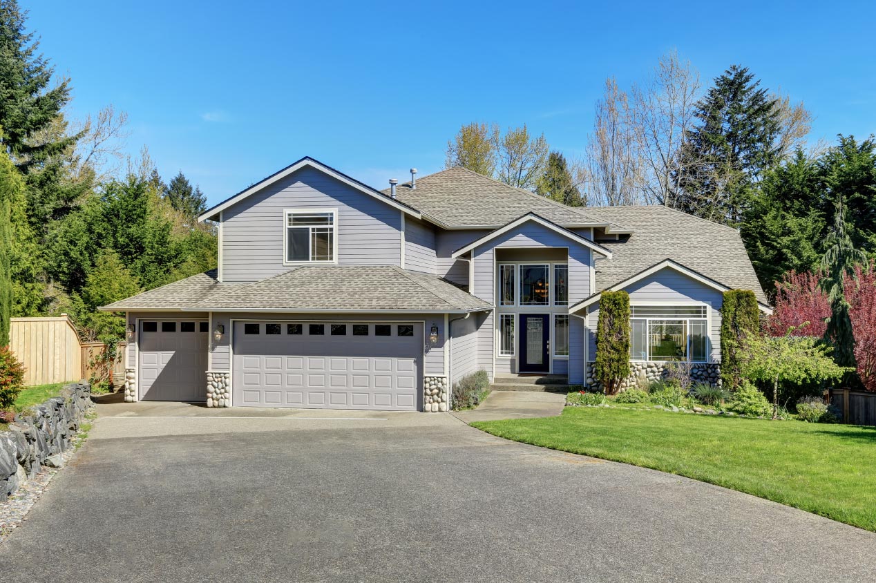 Traditional blue home exterior with wood siding