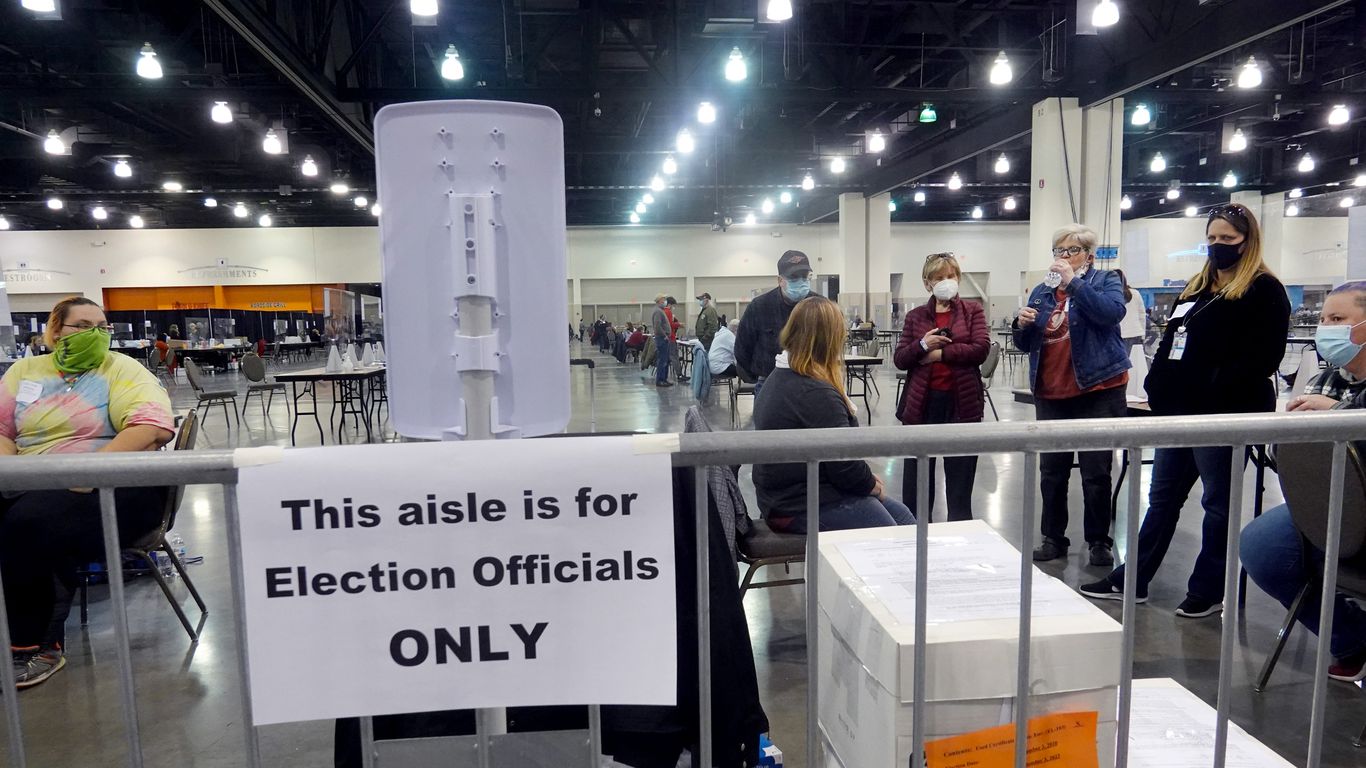 Wisconsin election officials listen as procedural issues are argued during the recount of the 2020 presidential election on Nov. 20, 2020.