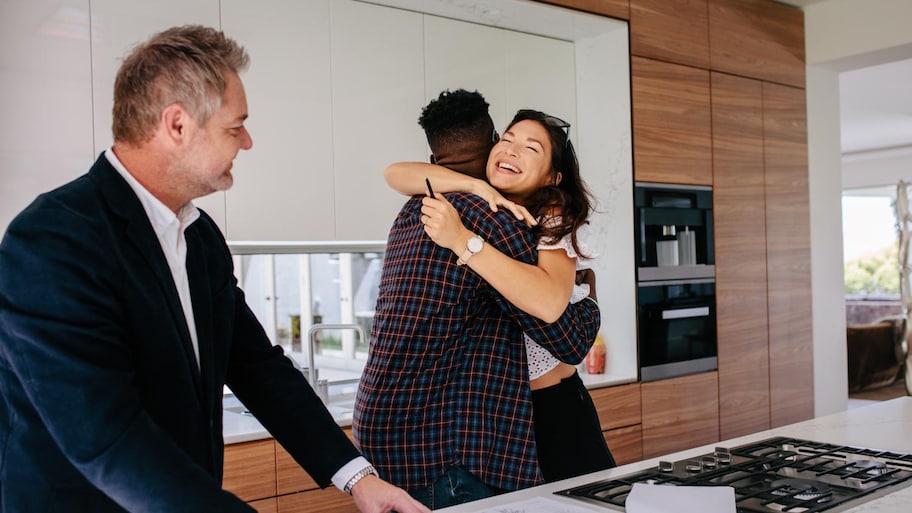 A happy couple buying a new house