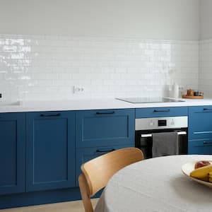 A white tiled kitchen