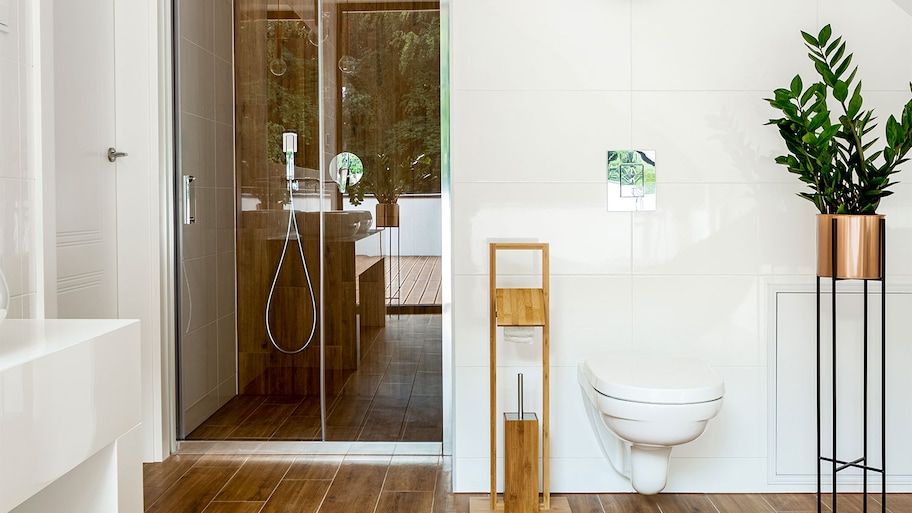 A bathroom with a potted plant