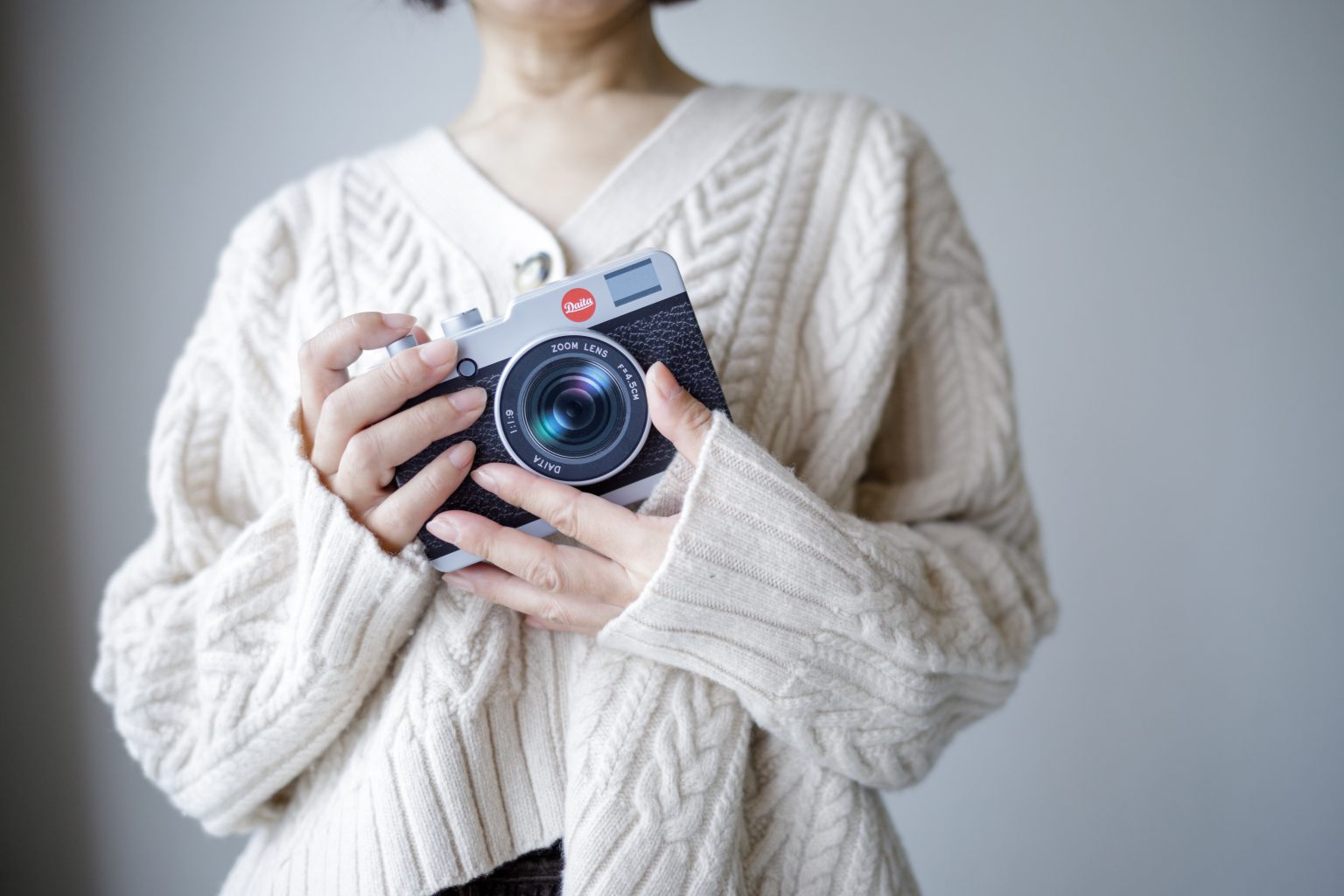 Tight medium shot of a person holding a chocolate camera in their hands. Photo contributed by Sysbird to the WordPress Photo Directory.