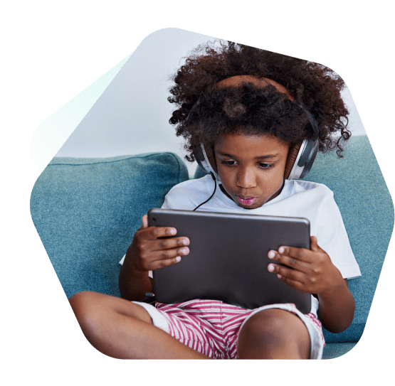 Boy watching YouTube safely on a laptop using Kaspersky Safe Kids