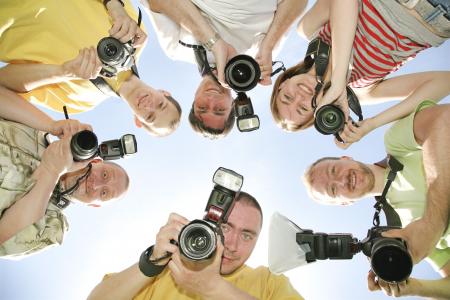 Six friends with cameras.